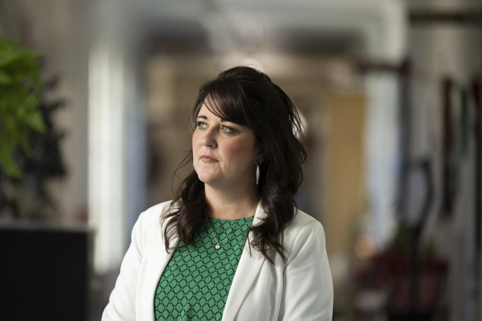 Amador County superintendent Torie Gibson poses in the hallway of the Amador County Office of Education in Jackson, Calif., Wednesday, Dec. 7, 2022. Gibson cancelled Amador High School's football season after learning the team had a group chat titled, 'Kill the Blacks,' filled with derogatory language and racial slurs. (AP Photo/José Luis Villegas)