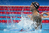 Caeleb Dressel, of the United States, celebrates after winning the men's 100-meter freestyle final at the 2020 Summer Olympics, Thursday, July 29, 2021, in Tokyo, Japan. (AP Photo/Charlie Riedel)