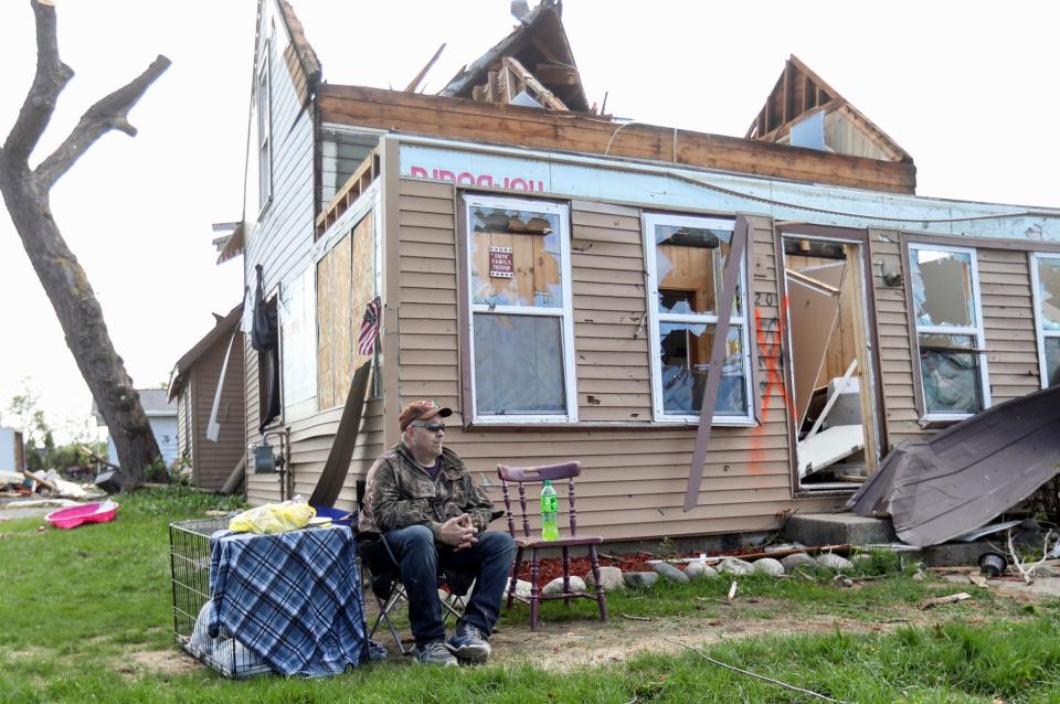 Residents of Gaylord assess damage after a tornado hit a section of the town Saturday, May 21, 2022.  Jerry Speckman sits in front of his destroyed home he rode the tornado out in his basemen.