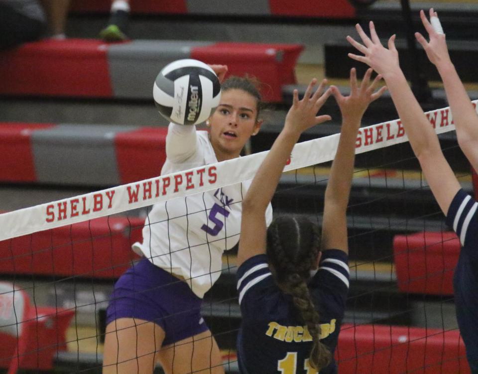 Lexington's Tatum Stover sends down a kill during Lady Lex's 3-1 loss to Norwalk in Thursday's Division II district championship match.