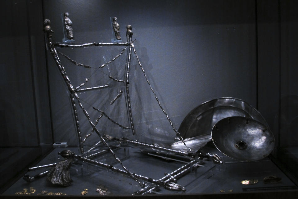 A woman's folding chair made from silver, dated to about 450 AD, displayed at the Martin-Gropius-Bau museum in Berlin, Thursday, Sept. 20, 2018. The new exhibition showcasing more than 1,000 major archaeological finds from the past 20 years shows reveals how Germany has been at the heart of European trade, migration, conflict and innovation since the Stone Age. The exhibition runs from Sept. 21, 2018 until Jan. 6, 2019. (AP Photo/Frank Jordans)