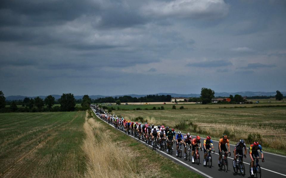 Clouds building as the peloton rides through