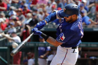 FILE - In this June 1, 2019, file photo, Texas Rangers' Joey Gallo connects for a two-run home run on a pitch from Kansas City Royals' Homer Bailey in the fourth inning of a baseball game in Arlington, Texas. Rangers slugger Joey Gallo has tested positive for COVID-19, though the team says the All-Star right fielder is asymptomatic. General manager Jon Daniels said Monday, July 6, 2020, that Gallo is isolated at his apartment in Dallas and not around teammates. (AP Photo/Tony Gutierrez, File)