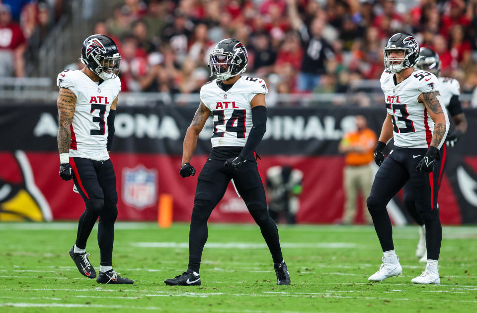 A.J. Terrell #24 of the Atlanta Falcons and teammate Jessie Bates III #3 