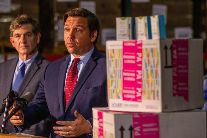 In a photo from March 13, 2020, Gov. Ron DeSantis holds a press conference at the Department of Health to inform the public that coronavirus test kits have arrived in Florida.