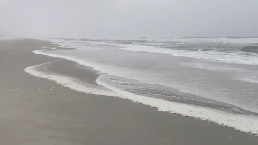 At low tide just before 5 p.m. Wednesday here was plenty of space on the beach, but gusts made it difficult to face into the wind and stinging sand hit eyes and exposed skin.