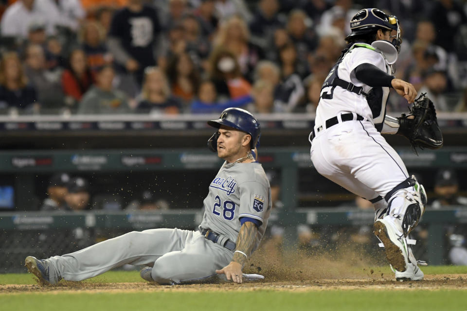 Kansas City Royals' Kyle Isbel (28) slides home safely past Detroit Tigers catcher Eric Haase on a sacrifice fly from Whit Merrifield in the eighth inning of a baseball game, Friday, Sept. 24, 2021, in Detroit. (AP Photo/Jose Juarez)