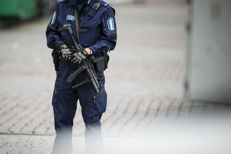 <p>An armed police officer on the Turku Market Square, Aug. 18, 2017, after several people were stabbed. (Roni Lehti/Lehtikuva via AP) </p>