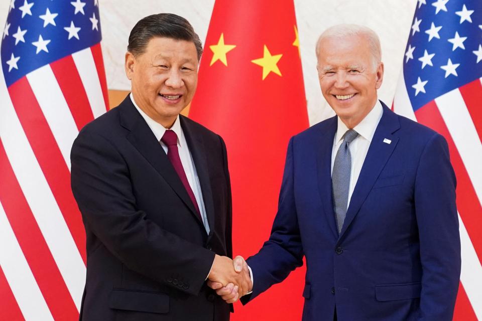 US president Joe Biden shakes hands with Chinese president Xi Jinping as they meet on the sidelines of the G20 leaders' summit in Bali (REUTERS)