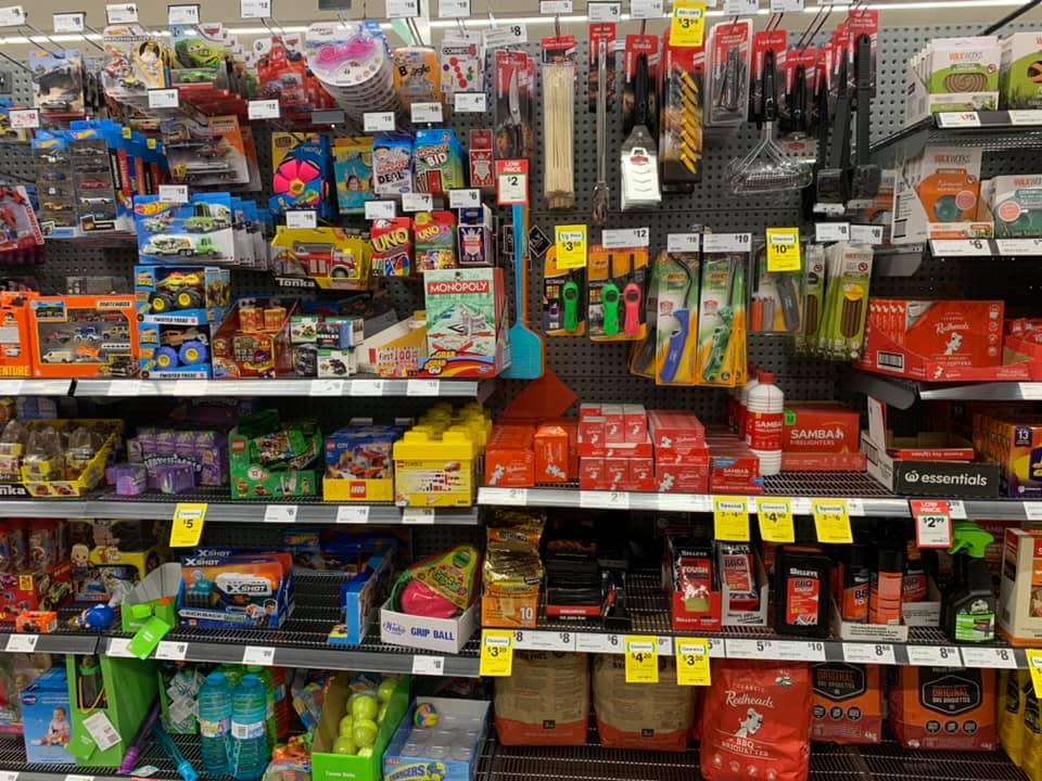 Toys and matches sold alongside one another on a supermarket shelf.