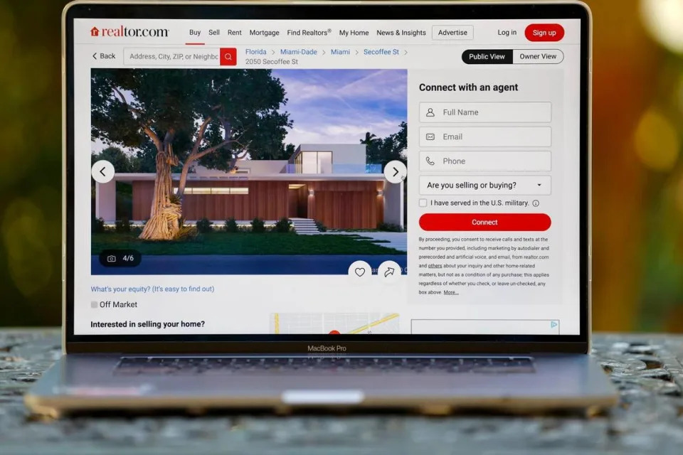 The image on the real estate website movoto.com shows a rendering of a house at 2050 Secoffee St. in Coconut Grove, on Feb. 25, 2023. The description includes three different wishful details: Under construction! expected completion Q3 2022 and Year built 2021.