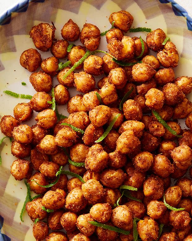 <p>Crispy on the outside and tender on the inside, these snack-able <a href="https://www.delish.com/cooking/recipe-ideas/g40692357/chickpea-recipes/" rel="nofollow noopener" target="_blank" data-ylk="slk:chickpeas;elm:context_link;itc:0;sec:content-canvas" class="link ">chickpeas</a> are delicious as a crunchy topper for salads, creamy soups, or grain bowls, too. You can also toss them with hot popcorn for a pretty killer, protein-packed <a href="https://www.delish.com/entertaining/g36106340/amazon-movie-snacks/" rel="nofollow noopener" target="_blank" data-ylk="slk:movie snack;elm:context_link;itc:0;sec:content-canvas" class="link ">movie snack</a>.</p><p>Get the <strong><a href="https://www.delish.com/cooking/recipe-ideas/a39721126/air-fryer-chickpeas-recipe/" rel="nofollow noopener" target="_blank" data-ylk="slk:Air Fryer Crunchy Chili-Spiced Chickpeas recipe;elm:context_link;itc:0;sec:content-canvas" class="link ">Air Fryer Crunchy Chili-Spiced Chickpeas recipe</a></strong>.</p>