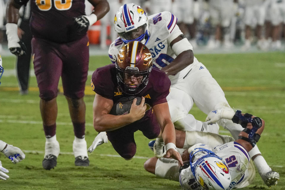 Arizona State quarterback Sam Leavitt (10) dives for a first down late in the game against Kansas during the second half of an NCAA college football game Saturday, Oct. 5, 2024, in Tempe, Ariz. (AP Photo/Darryl Webb)