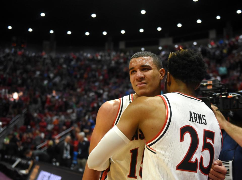 Texas Tech's Kevin McCullar (15), left, becomes emotional after the team’s win against Notre Dame in the NCAA tournament’s second round game, Sunday, March 20, 2022, at Viejas Arena in San Diego, California. Texas Tech won, 59-53.