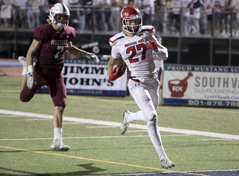 American Fork’s Chase Roberts makes a 69-yard touchdown during game against Herriman on Thursday, Sept. 6, 2018. | Kristin Murphy, Deseret News