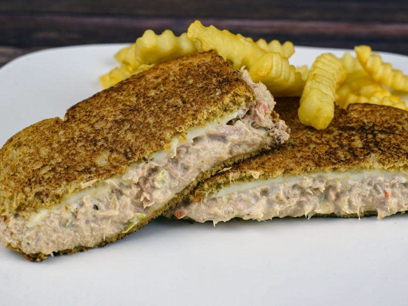 tuna melt with crinkle fries on a plate