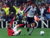 FILE - In this Oct. 7, 2000 file photo Germany's Michael Ballack gets past England's Paul Scholes, left, during the group nine World Cup qualification match England versus Germany at Wembley stadium in London. The last game at the old Wembley turned out to be Kevin Keegan's last game in charge of England's national team. The coach decided to quit while seeking privacy in a bathroom cubicle shortly after Dietmar Hamann's free kick squirmed through the hands of goalkeeper David Seaman. (AP Photo/Max Nash, File)