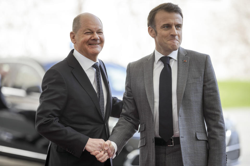 German Chancellor Olaf Scholz, left, shakes hands with French President Emmanuel Macron in Berlin, Germany, Friday, March 15, 2024. German Chancellor Olaf Scholz, France's President Emmanuel Macron and Poland's Prime Minister Donald Tusk meet in Berlin for the so-called Weimar Triangle talks. (AP Photo/Markus Schreiber)