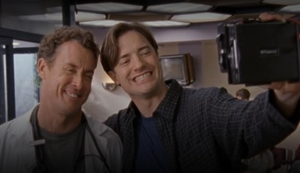 Ben and Dr. Cox taking a selfie in "Scrubs"