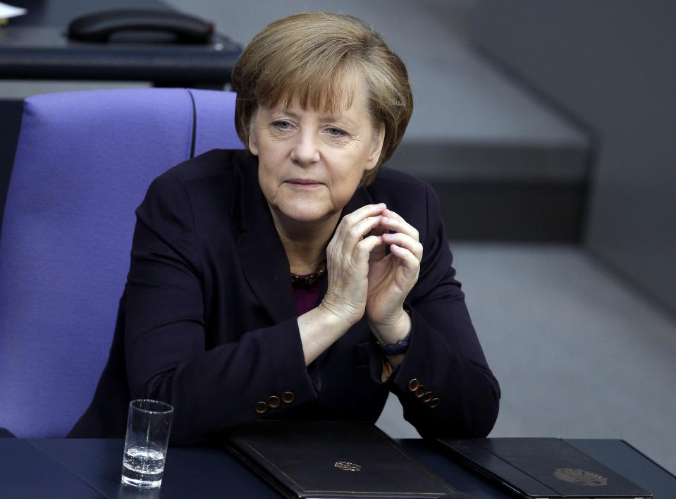 German Chancellor Angela Merkel attends a meeting of the German parliament, Bundestag, in Berlin, Thursday, March 20, 2014. Russia faces further sanctions from the European Union on Thursday over its annexation of the Crimea Peninsula as tensions in the region remained high despite the release of a Ukrainian naval commander. In an address to the German Parliament, Chancellor Angela Merkel said the EU was readying further sanctions and that the G-8 forum of leading economies had been suspended indefinitely. Russia holds the presidency of the G-8 and President Vladimir Putin was due to host his counterparts, including President Barack Obama, at a summit in Sochi in June. (AP Photo/Michael Sohn)