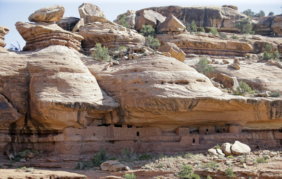 FILE - This July 15, 2016, file photo, U.S. The "Moonhouse" in McLoyd Canyon, near Blanding, Utah, is shown during U.S. Interior Secretary Sally Jewell tour. The U.S. government is unveiling its final management plan for the Bears Ears National Monument on tribal lands home to ancient cliff dwellings and other artifacts in Utah that was significantly downsized by President Donald Trump. Conservation groups, tribes and an outdoor retail company have sued challenging the downsizing. (AP Photo/Rick Bowmer, File)