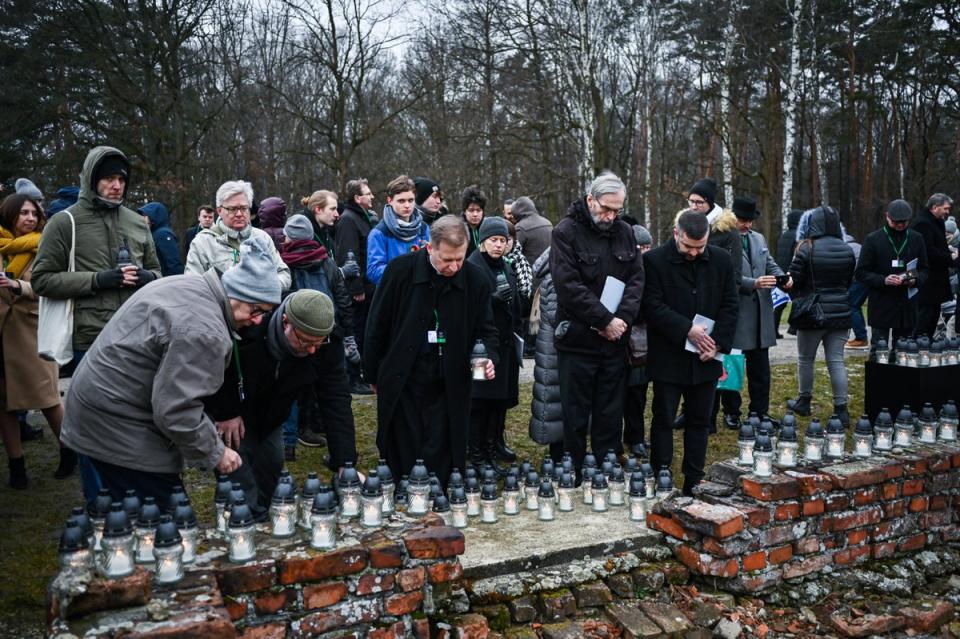 Candles are lit in the ruins of the Nazi camp Auschwitz-Birkenau (Getty)