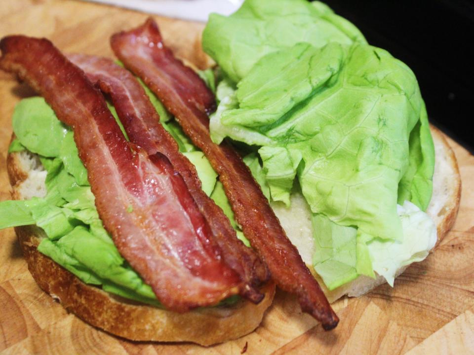lettuce avocado and bacon on two slices of bread