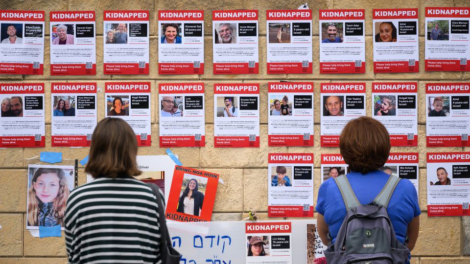Photographs of some of those taken hostage by Hamas during their recent attacks are seen on October 18, 2023 in Tel Aviv, Israel. - Leon Neal/Getty Images