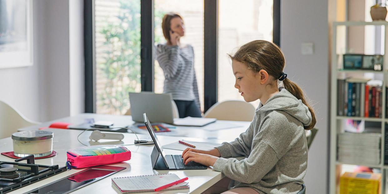 girl doing school class online at home virtual learning