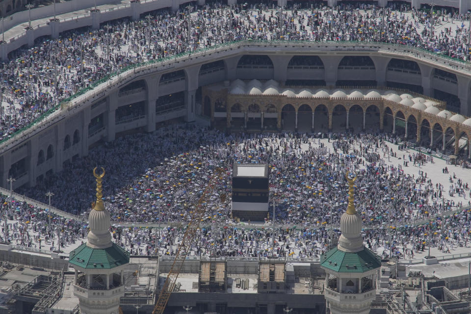 Muslim pilgrims circumambulate the Kaaba, the cubic building at the Grand Mosque, during the annual Hajj pilgrimage in Mecca, Saudi Arabia, Monday, June 17, 2024. Muslim pilgrims used the early morning hours Monday to perform the second day of the symbolic stoning of the devil, as noontime summer heat caused heatstroke among thousands wrapping up the Hajj pilgrimage. (AP Photo/Rafiq Maqbool)