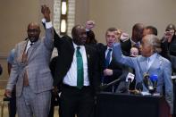 FILE - In this April 20, 2021, file photo, Philonise Floyd, Attorney Ben Crump and the Rev, Al Sharpton, from left, react after a guilty verdict was announced at the trial of former Minneapolis police Officer Derek Chauvin for the 2020 death of George Floyd, Tuesday,, in Minneapolis, Minn. Former Minneapolis police Officer Derek Chauvin faces decades in prison when he is sentenced Friday, June 25, 2021, following his murder and manslaughter convictions in the death of George Floyd. Floyd's death, filmed by a teenage bystander as Chauvin pinned Floyd to the pavement for about 9 and a half minutes and ignored Floyd's "I can't breathe" cries until he eventually grew still, reignited a movement against racial injustice that swiftly spread around the world and continues to reverberate. (AP Photo/Julio Cortez, File)