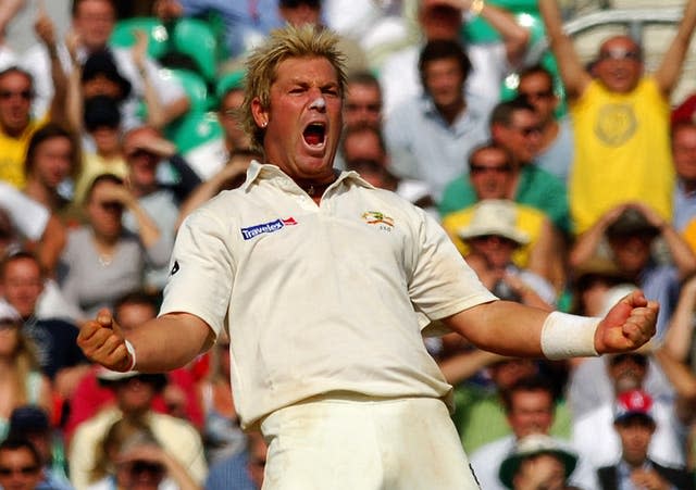Australia’s Shane Warne celebrates after he caught and bowled England’s Andrew Flintoff for eight runs during the final day of the fifth npower Test match at the Oval in September 2005 