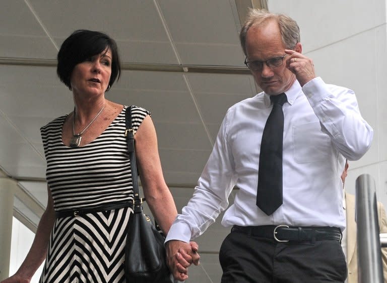 Rick Todd and his wife Mary, pictured at the Subordinate courts in Singapore, on May 21, 2013. The family of an American scientist found hanged in Singapore last year dismissed on Tuesday the city-state's findings that he committed suicide as "a sham and a cover-up" for a murder