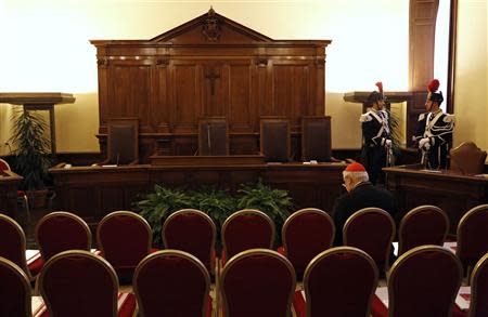 A cardinal waits in the hall of the Palace of the Tribunal before the opening of the Judicial Year of the Tribunal of Vatican City at the Vatican, January 11, 2014. REUTERS/Stefano Rellandini