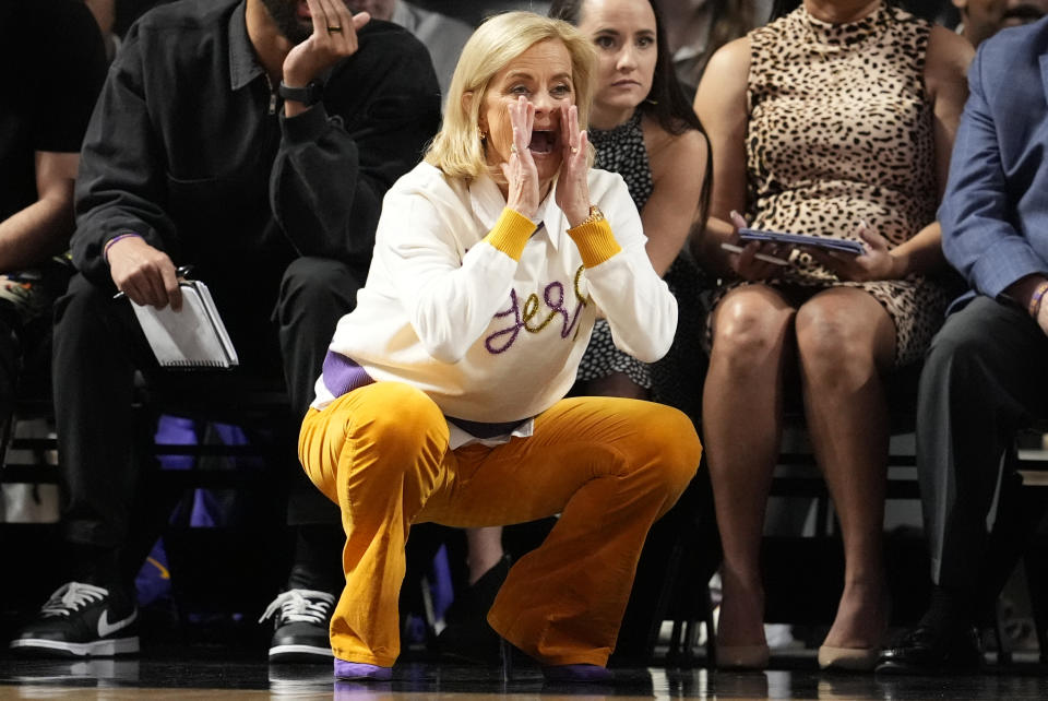 LSU head coach Kim Mulkey yells to her players during the first half of an NCAA college basketball game against Vanderbilt, Thursday, Feb. 8, 2024, in Nashville, Tenn. (AP Photo/George Walker IV)