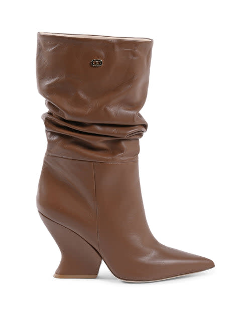 <p><a href="https://deeocleppo.com/products/cady-boot-dark-brown" rel="nofollow noopener" target="_blank" data-ylk="slk:Shop Now;elm:context_link;itc:0;sec:content-canvas" class="link ">Shop Now</a></p><p>The Cady Boot</p><p>deeocleppo.com</p><p>$217.50</p>
