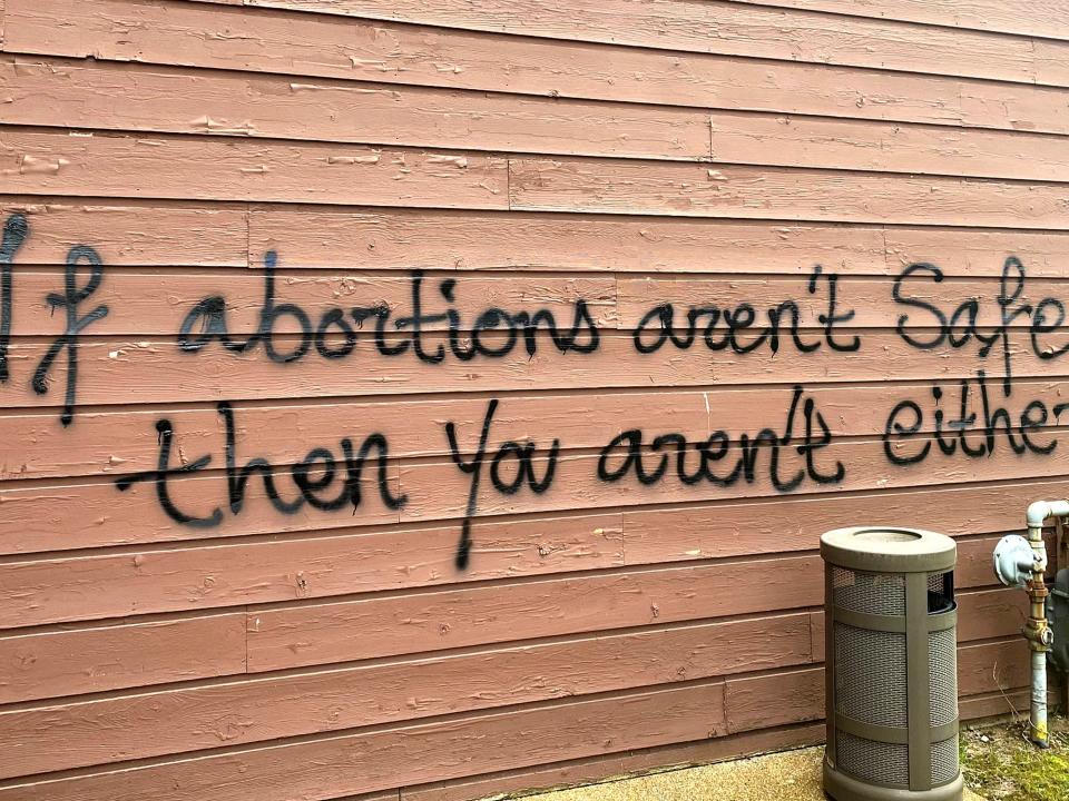 Threatening graffiti is seen on the exterior of Wisconsin Family Action offices in Madison, Wis., on May 8, 2022.