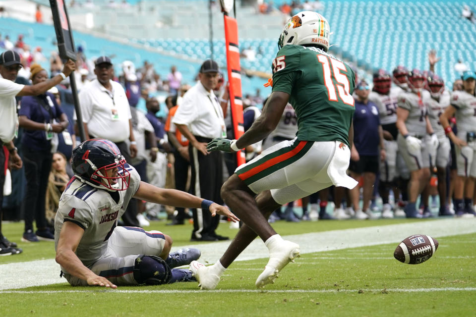 Jackson State quarterback Jason Brown (4) drops a pass thrown to him at the goal line as Florida A&M defensive back Winsome Frazier (15) defends during the second half of the Orange Blossom Classic NCAA college football game, Sunday, Sept. 3, 2023, in Miami Gardens, Fla. (AP Photo/Lynne Sladky)