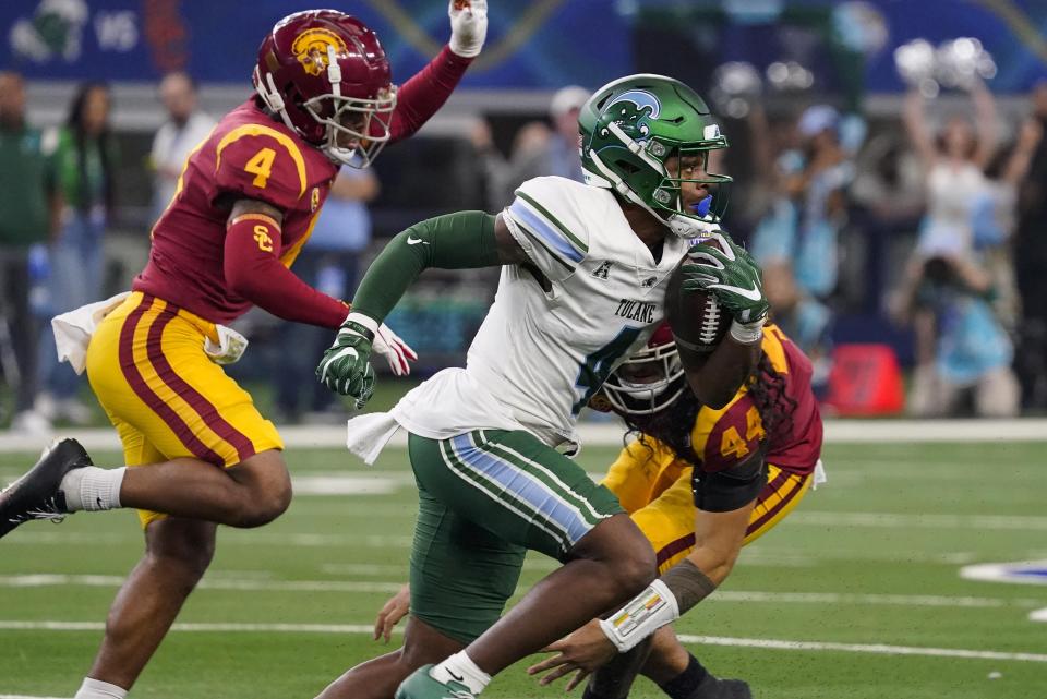 Tulane wide receiver Jha'Quan Jackson runs with the ball during the first half of the Cotton Bowl NCAA college football game against Southern California, Monday, Jan. 2, 2023, in Arlington, Texas. (AP Photo/Sam Hodde)