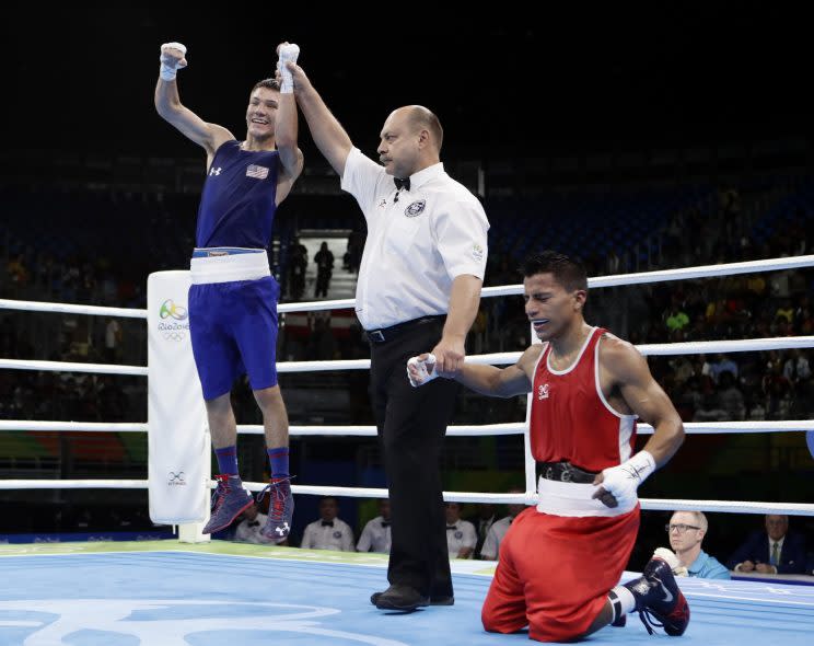 Nico Hernandez reacts after winning the decision that guaranteed him a medal. (AP)