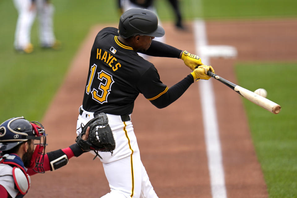 Pittsburgh Pirates' Ke'Bryan Hayes (13) singles off Boston Red Sox starting pitcher Josh Winckowski, driving in a run, during the first inning of a baseball game in Pittsburgh, Sunday, April 21, 2024. (AP Photo/Gene J. Puskar)