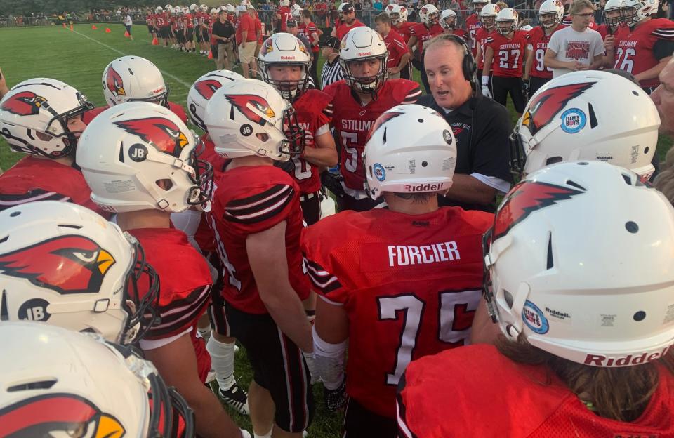 Stillman Valley football coach Mike Lalor talks to his team during after the first half on Friday, Aug. 26, 2022 against Byron at Stillman Valley.