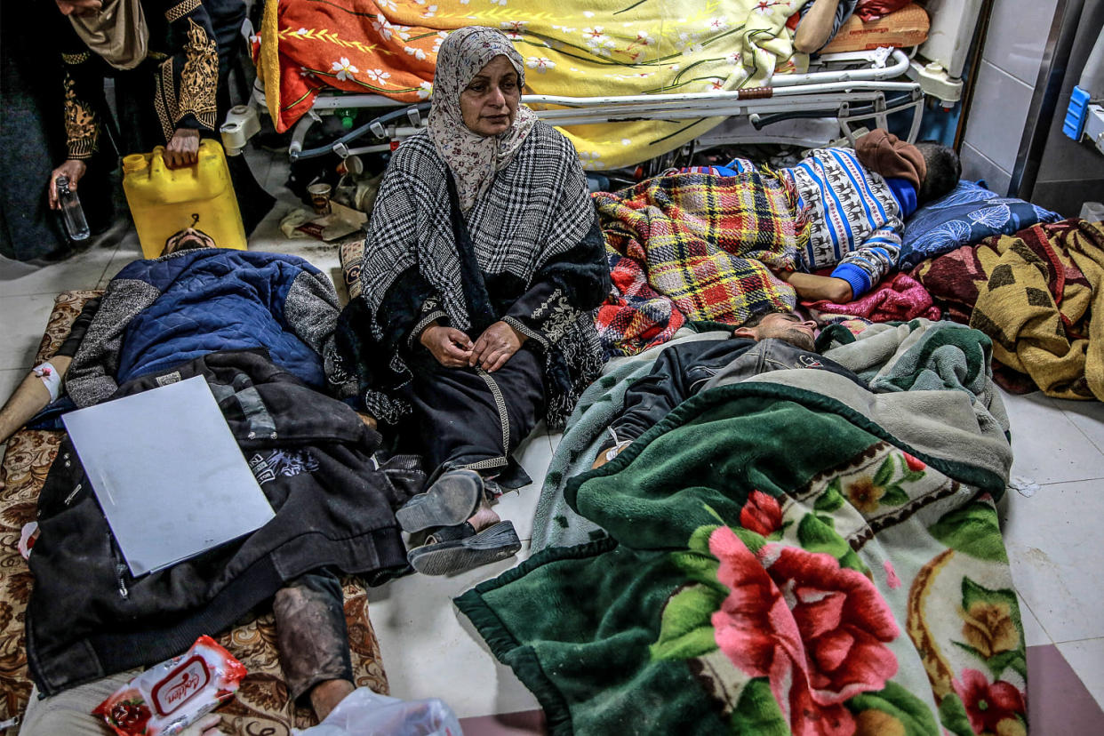 Image:  A woman sits among Palestinians at Al-Shifa hospital in Gaza City  (AFP - Getty Images)