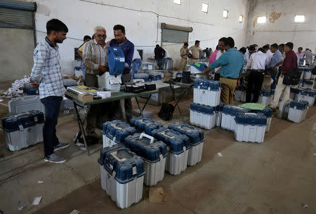 Election staff prepare Voter Verifiable Paper Audit Trail (VVPAT) machines and Electronic Voting Machines (EVM) ahead of India's general election at a warehouse in Ahmedabad, India, March 6, 2019. REUTERS/Amit Dave