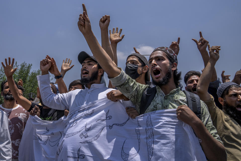 Kashmiri traders shout Islamic slogans during a protest against Nupur Sharma, a spokesperson of governing Hindu nationalist party over her remarks about Prophet Mohammed, during a protest in Srinagar, Indian controlled Kashmir, Friday, June 10, 2022. In Indian-controlled Kashmir, authorities locked down two towns on Friday and snapped internet on mobile phones in several towns and in Srinagar, the disputed region’s main city, fearing anger against the insulting remarks to Islam could morph into larger, anti-India protests. (AP Photo/Dar Yasin)