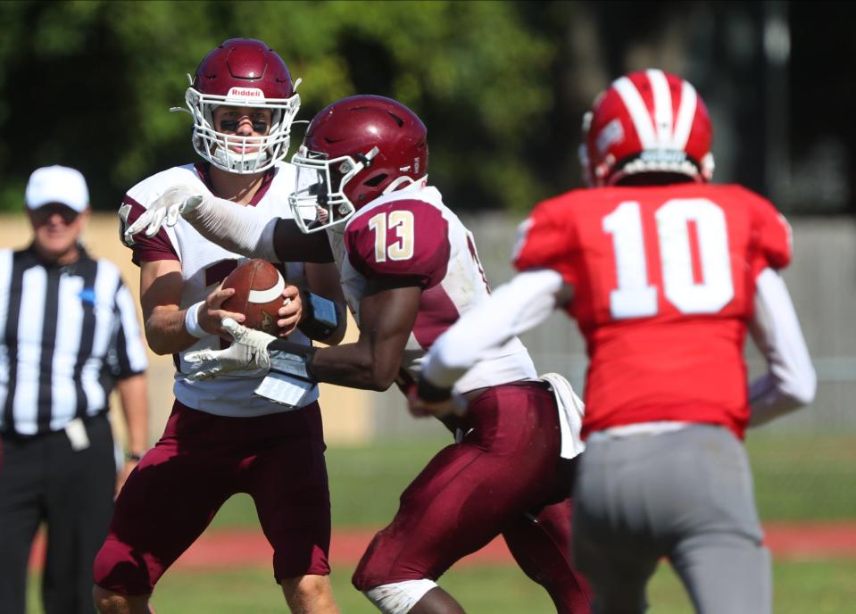 O'Neill running back Jordan Thompson takes the handoff from Nick Waugh against Red Hook during a Sept. 24, 2022 football game.