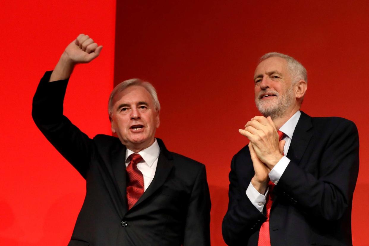 <p>Former shadow chancellor John McDonnell with Jeremy Corbyn at the Labour Party conference</p> (AP)