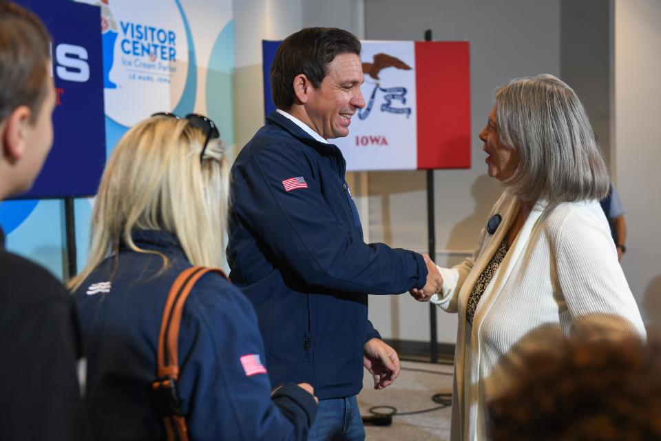 Gov. Ron DeSantis shakes hands with attendees on Monday, Oct. 9, 2023 at Wells Visitor Center & Ice Cream Parlor in Le Mars, Iowa.