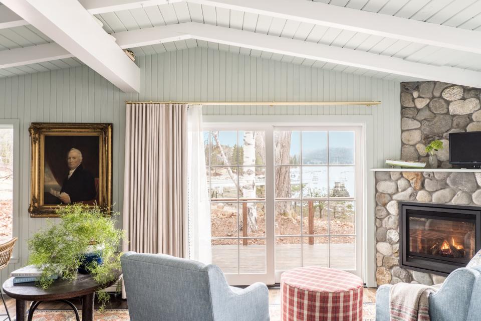 The Claremont Hotel Cottage interior with view of Mount Desert Island and fireplace in the corner