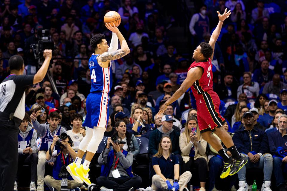 Second round: Sixers forward Danny Green (14) shoots over Heat defender Kyle Lowry (7) during the first half of Game 3.